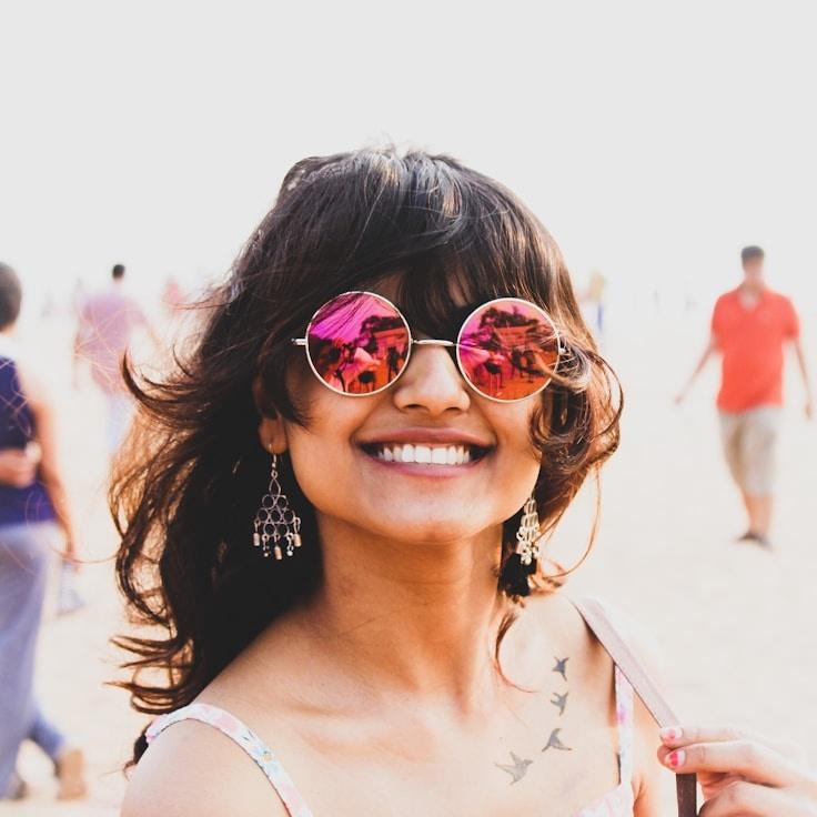 Kaveri Mehta, Lead Design Curator at Linen Path Signal, reviewing corporate floral arrangements